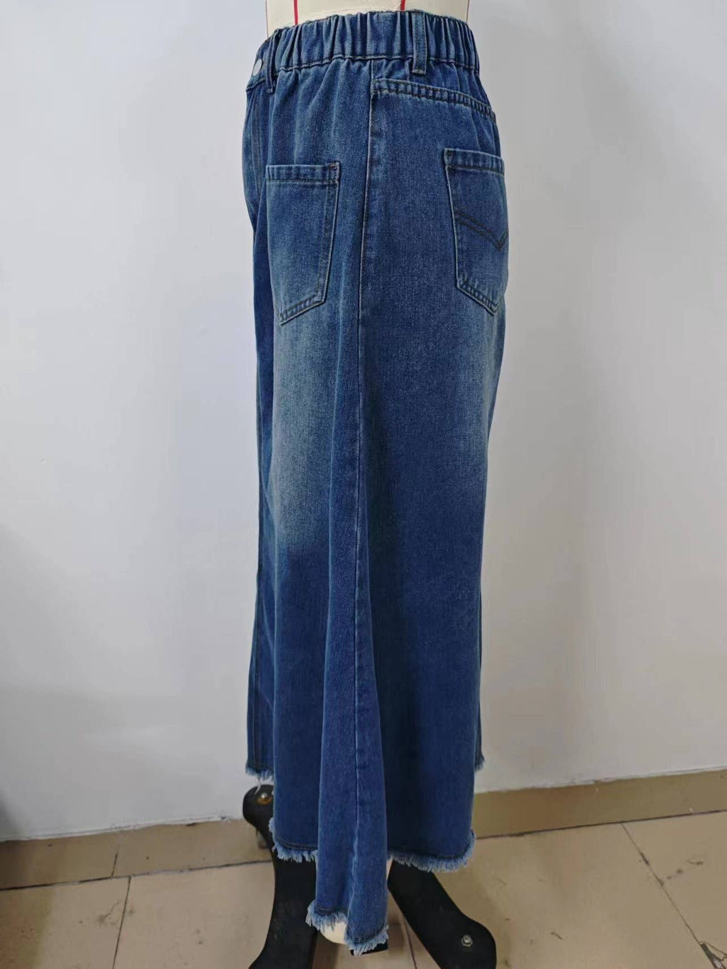 WASHED DENIM SKIRT WITH RAW HEM MIDI